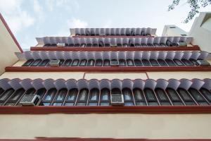 a building with rows of seats on top of it at Hotel Shalimar in Jaipur