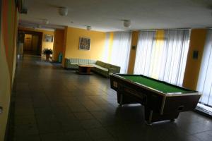 a room with a pool table in a building at Jäneda Guesthouse in Jäneda