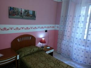 Postel nebo postele na pokoji v ubytování Roxena house