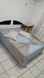 Tempat tidur dalam kamar di Hostel Fariafaz