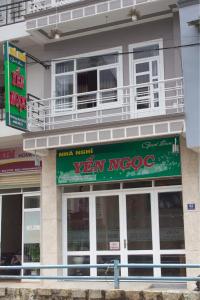 a building with a sign on the side of it at Yen Ngoc Guesthouse in Da Lat
