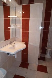 Koupelna v ubytování Hotel Napsugar