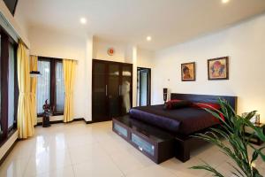 Ein Bett oder Betten in einem Zimmer der Unterkunft Villa L'Orange Bali