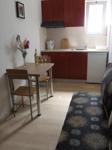 A kitchen or kitchenette at Angelica Studios and Apartments