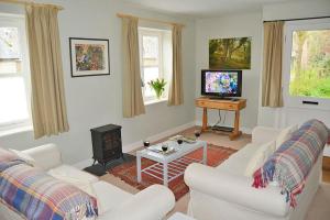Televiisor ja/või meelelahutuskeskus majutusasutuses Stable Cottage