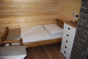 A bed or beds in a room at Chata Nezábudka