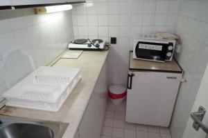 Kuchyň nebo kuchyňský kout v ubytování Hotel Napsugar