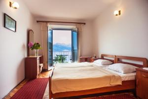 Postel nebo postele na pokoji v ubytování Boutique Hotel Tomić