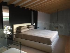 En eller flere senge i et værelse på Horta dos Cedros