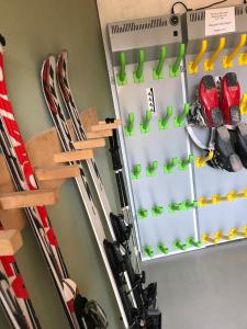 a room with skis and other ski equipment at Ciasa de Zeno in La Valle