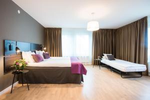 Postel nebo postele na pokoji v ubytování Best Western Plus Park Airport Hotel