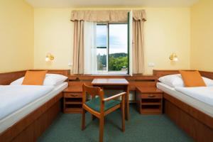 Postel nebo postele na pokoji v ubytování Spa Resort Libverda - Hotel Panorama + 28 fotografií