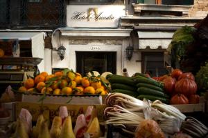 a display of fruits and vegetables in a market at Arcadia Boutique Hotel in Venice