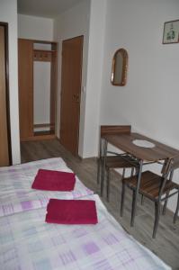 A bed or beds in a room at Privát Magdalena
