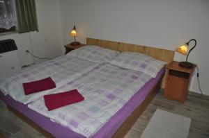 A bed or beds in a room at Privát Magdalena