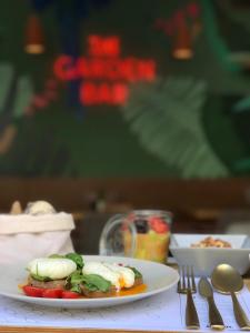 a plate of food on a table with a plate of food at Colors Urban Hotel Thessaloniki in Thessaloniki