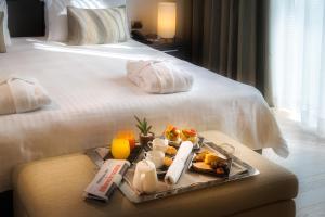 A bed or beds in a room at Domina Milano Fiera