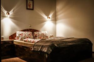 Postelja oz. postelje v sobi nastanitve Framski Hram Guest House