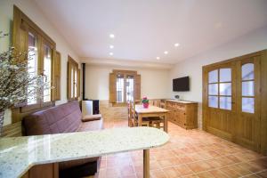 a living room with a couch and a table at Casa Rural Francisca in Requena