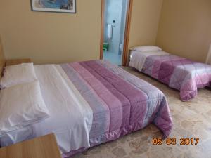 Voodi või voodid majutusasutuse Hotel Mazzocchetti toas