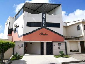 a building with a sign on the front of it at Hotel Reobot in Garanhuns