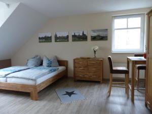 En eller flere senge i et værelse på Ferienwohnung Ortrand - Pension