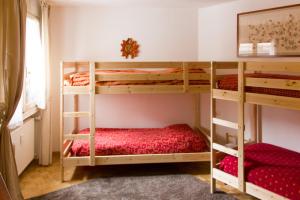 a bedroom with two bunk beds in a room at Un nido in centro in Madesimo