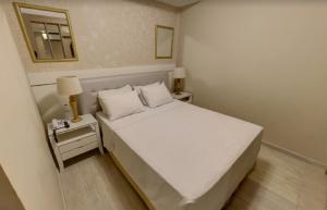 Ein Bett oder Betten in einem Zimmer der Unterkunft Ecos Hotel Tourist