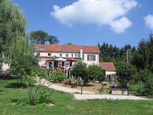a large house with a garden in front of it at Hotel La Croix des Bois in Lalizolle