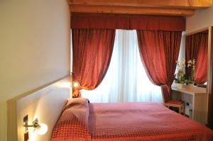 Postel nebo postele na pokoji v ubytování Hotel 5 Colonne