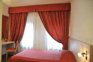 Postel nebo postele na pokoji v ubytování Hotel 5 Colonne