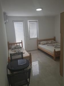 Katil atau katil-katil dalam bilik di Apartmani Vila Ebra