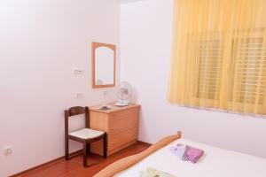 Postel nebo postele na pokoji v ubytování Apartmani Galija