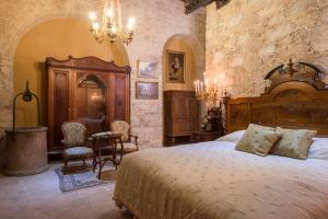 Кровать или кровати в номере Hotel Museo Palacio de San Agustin