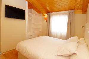 Postel nebo postele na pokoji v ubytování Hostal riMboMbin