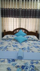 Postel nebo postele na pokoji v ubytování Anura Home Stay