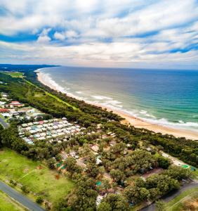 an aerial view of a beach and the ocean at Ingenia Holidays Bonny Hills in Bonny Hills