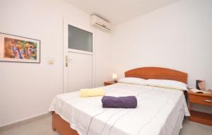 Postel nebo postele na pokoji v ubytování Apartments Mara