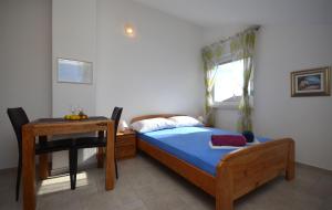 Postel nebo postele na pokoji v ubytování Apartments Mara