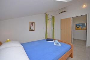 Postel nebo postele na pokoji v ubytování Apartments Mara