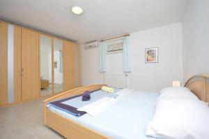 Postel nebo postele na pokoji v ubytování Apartments Mara