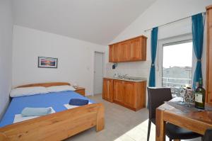 Postel nebo postele na pokoji v ubytování Apartments Mara
