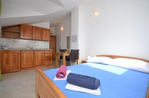 Postel nebo postele na pokoji v ubytování Apartments Mara