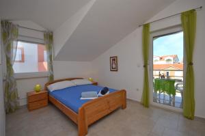 Postel nebo postele na pokoji v ubytování Apartments Mara