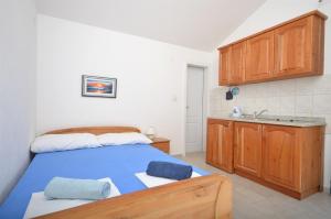 Postel nebo postele na pokoji v ubytování Apartments Mara