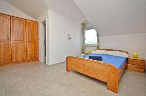 Postel nebo postele na pokoji v ubytování Apartments Mara