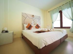 Postel nebo postele na pokoji v ubytování Lanta Fevrier Resort
