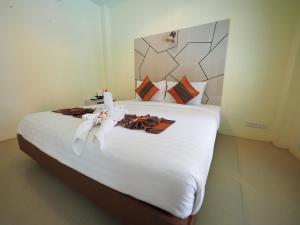 Postel nebo postele na pokoji v ubytování Lanta Fevrier Resort