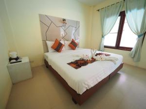 Postel nebo postele na pokoji v ubytování Lanta Fevrier Resort