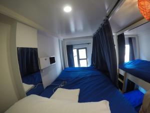 Letto o letti in una camera di Mandala Yoga Hostel